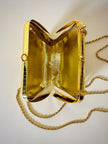 Mini clutch in metallo oro con tracolla in catena