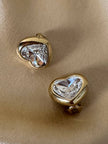 Clip dorate a forma di cuore con strass centrale