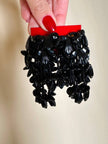 Clip a grappolo realizzate con perline nere