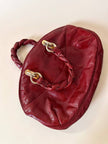 Borsa in pelle rosso bruciato con manici a treccia