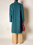 Cappotto doppiopetto in lana bouclé verde bosco con fodera firmata