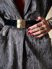 Cintura in camoscio nero con placca logata in metallo oro “Yves Saint Laurent”