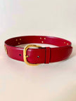 Cintura Gucci in pelle rossa con borchie a ferro di cavallo