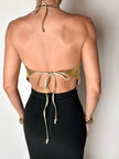 Top vintage con schiena nuda in pelle laminata oro