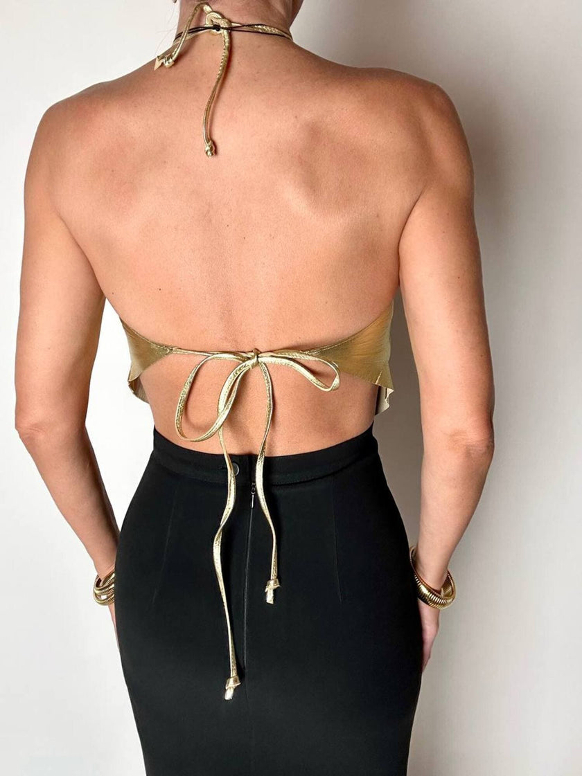 Top vintage con schiena nuda in pelle laminata oro