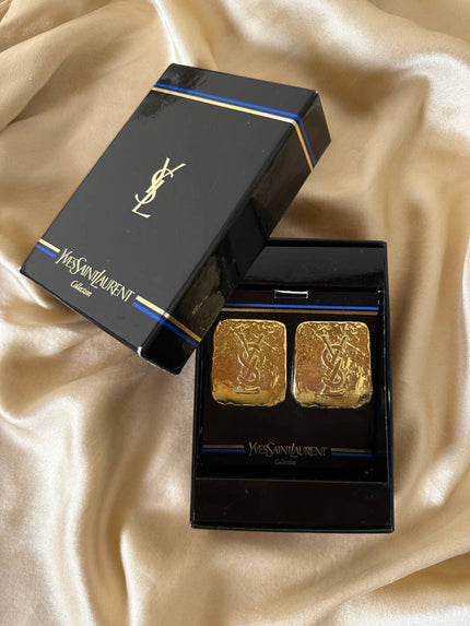 Maxi clip oro con logo “Yves Saint Laurent”
