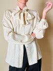 Camicia in seta Jaquard avorio con grande fiocco al collo