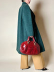 Cappotto doppiopetto in lana bouclé verde bosco con fodera firmata