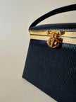 Mini bag a trapezio in ecopelle nera stampa lizard