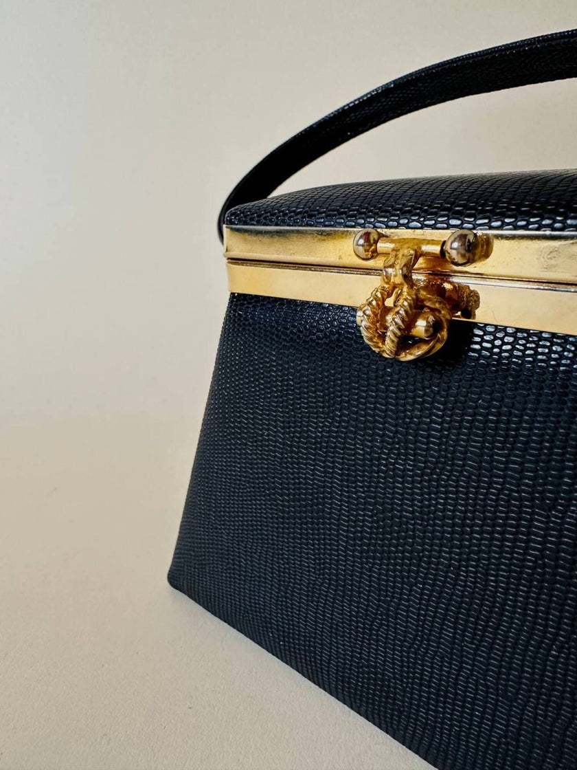 Mini bag a trapezio in ecopelle nera stampa lizard