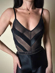 Collant vintage Yves Saint Laurent in lycra lucida nera con elastico logato