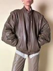Bomber con maniche rimovibili in pelle color fango “Arpell”