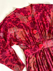 Jumpsuit sartoriale a fantasia floreale nei toni del rosso e maxi bottoni