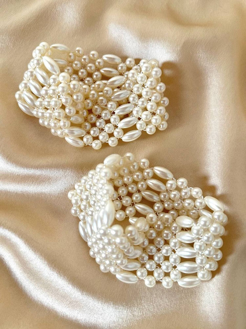 Polsiere elasticizzate di perle sintetiche bianche