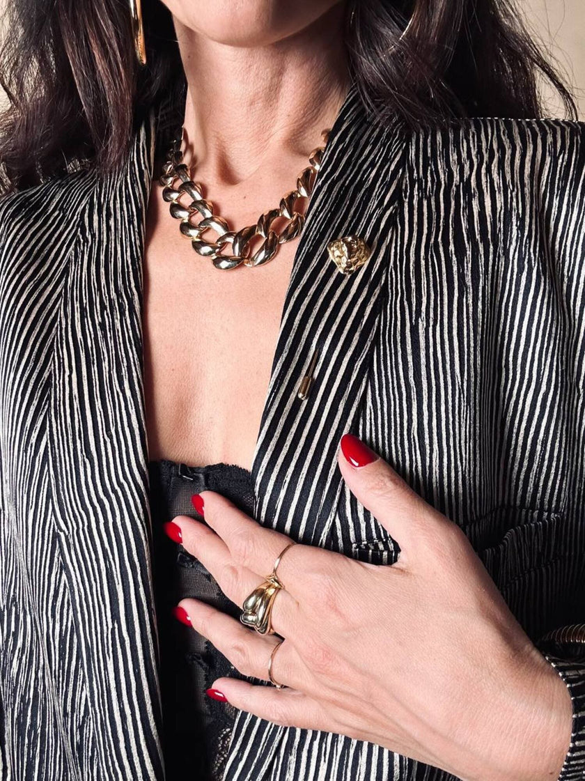 Spillone dorato con pepita “Yves Saint Laurent”