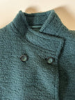 Cappotto doppiopetto in lana bouclé verde bosco con fodera firmata