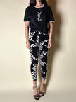 T-shirt vintage Yves Saint Laurent in cotone nero con logo YSL in lamé argento e strass