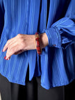 Bracciale vintage rigido in metallo dorato e pelle di serpente rossa
