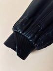 Bomber fatto a mano in pelle nera con maxi collo in mongolia