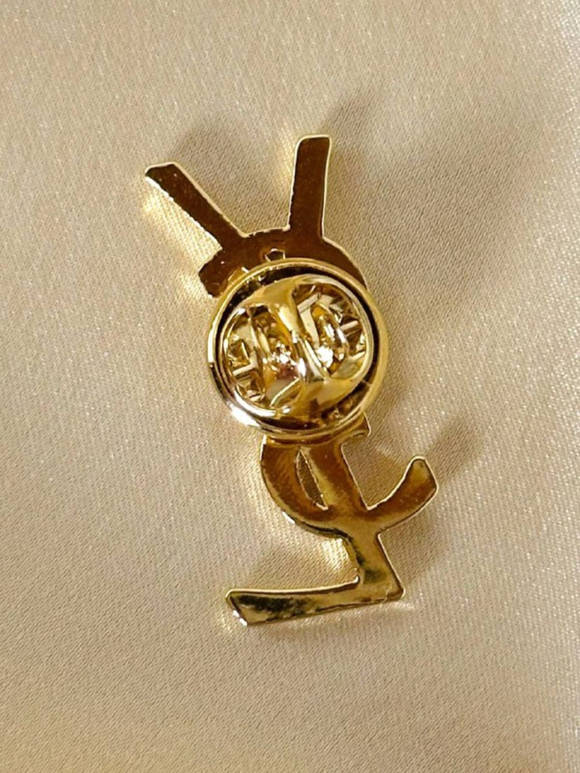 Spilla logo Yves Saint Laurent color oro