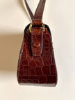 Bandoulière in pelle stampa coccodrillo color cognac “Andrea Mabiani”