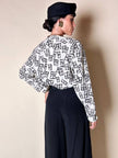 Blusa Yves Saint Laurent in tessuto jacquard bianco e nero fantasia Domino