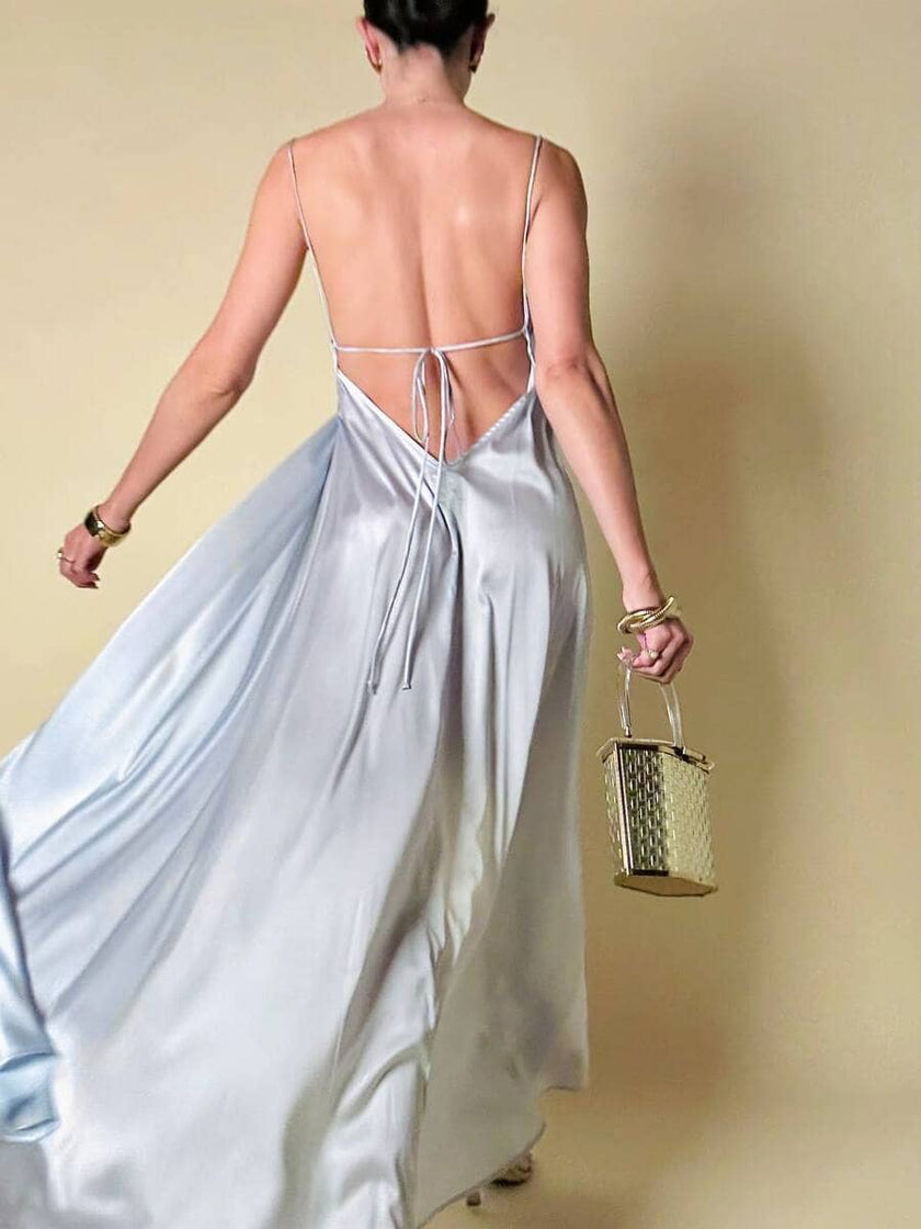 Maxi dress con schiena nuda in raso grigio perla “Mercí”