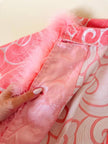 Abito in tessuto Jacquard rosa profilato con marabù in tinta