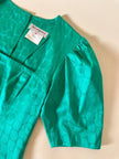 Abito verde smeraldo con abbottonatura posteriore “Yves Saint Laurent”