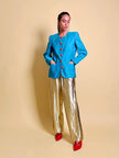 Blazer in shantung turchese con bottoni rossi a forma di cuore 