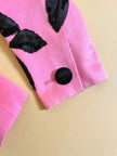 Blazer rosa con maxi fiori in paillettes nere 