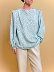 Blusa in tessuto Jaquard acqua marina con ricami floreali