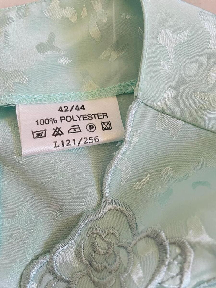 Blusa in tessuto Jaquard acqua marina con ricami floreali