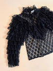 Blusa in pizzo nero con volant 