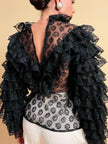 Blusa in pizzo nero con volant 