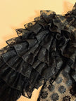 Blusa in pizzo nero con volant 
