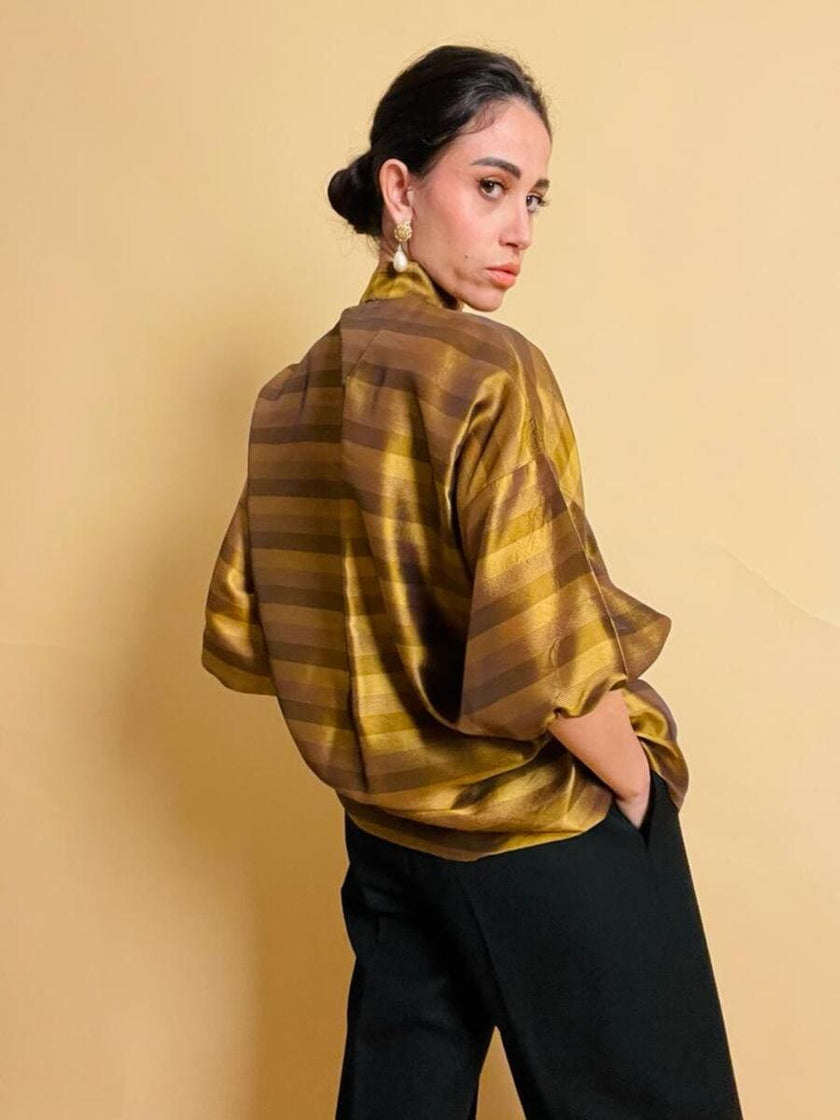 Puffy blouse in seta color ambra con maxi fiocco