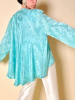 Blouse cape en soie Jacquard aigue-marine « Vizio »