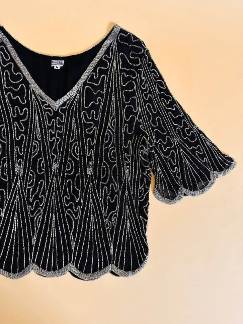 Blusa nera in chiffon di seta ricamata con perline silver