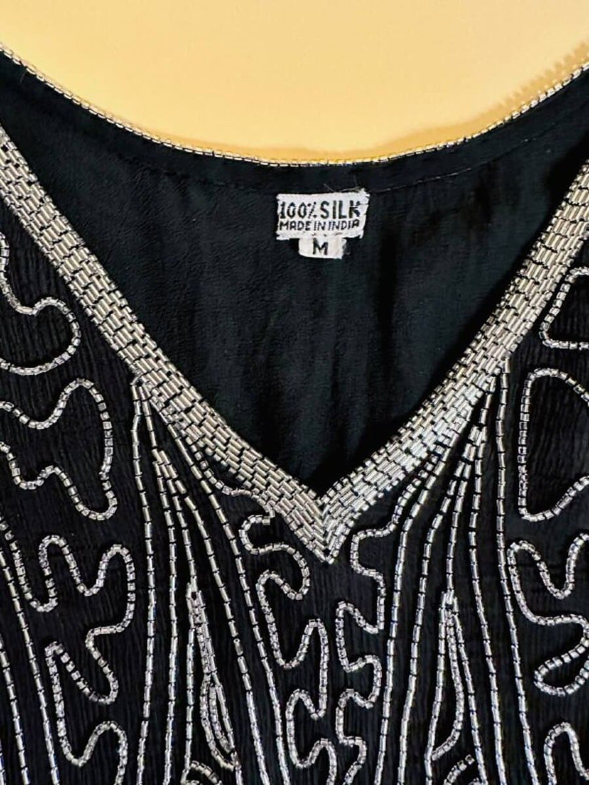 Blusa nera in chiffon di seta ricamata con perline silver