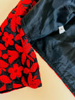 Bolero in tessuto lucido nero con ricamo floreale rosso