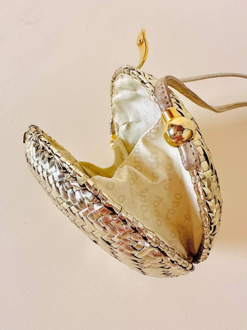 Borsa rotonda in midollino oro con tracolla in pelle laminata oro “Rodo”