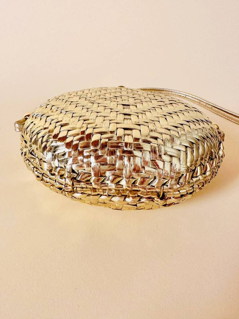 Borsa rotonda in midollino oro con tracolla in pelle laminata oro “Rodo”
