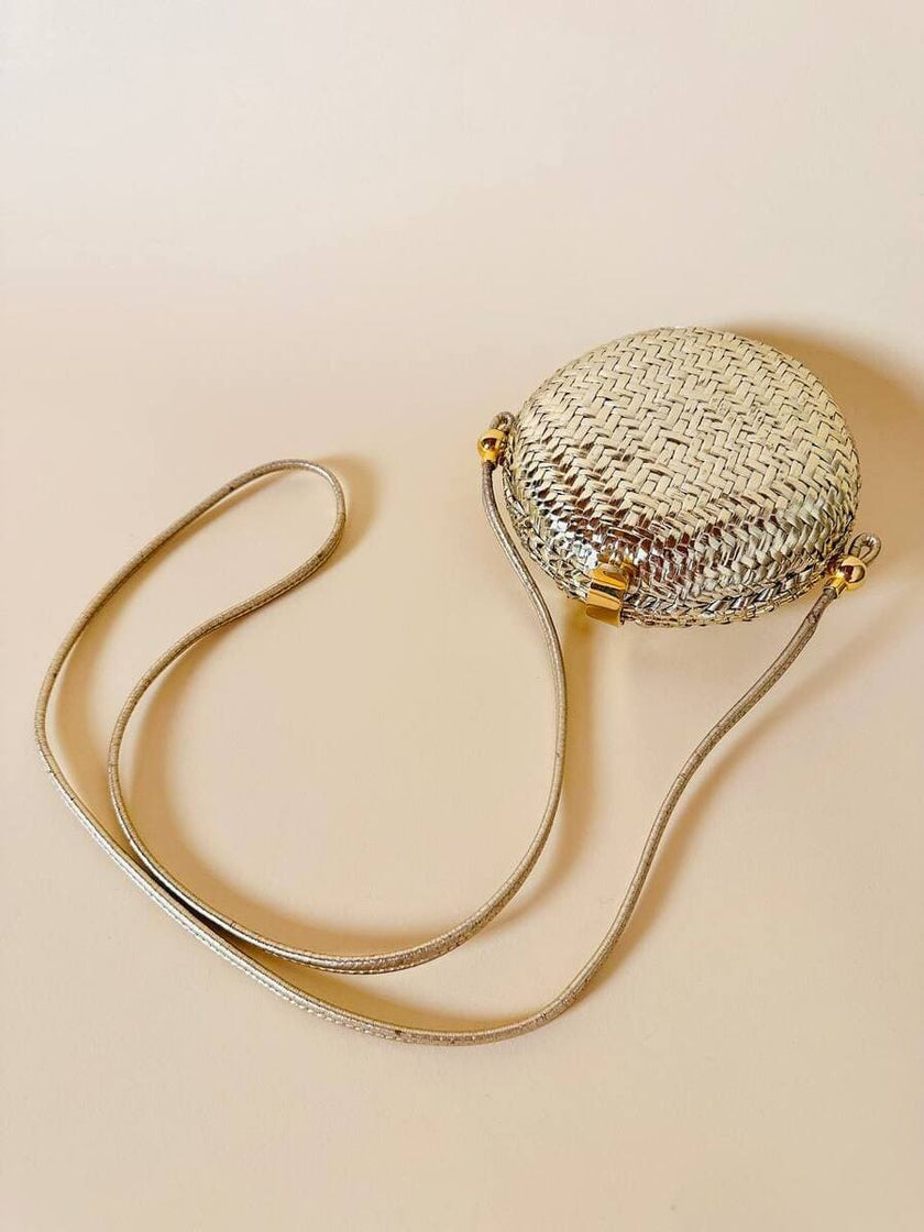Borsa rotonda in midollino oro con tracolla in pelle laminata oro “Rodo”