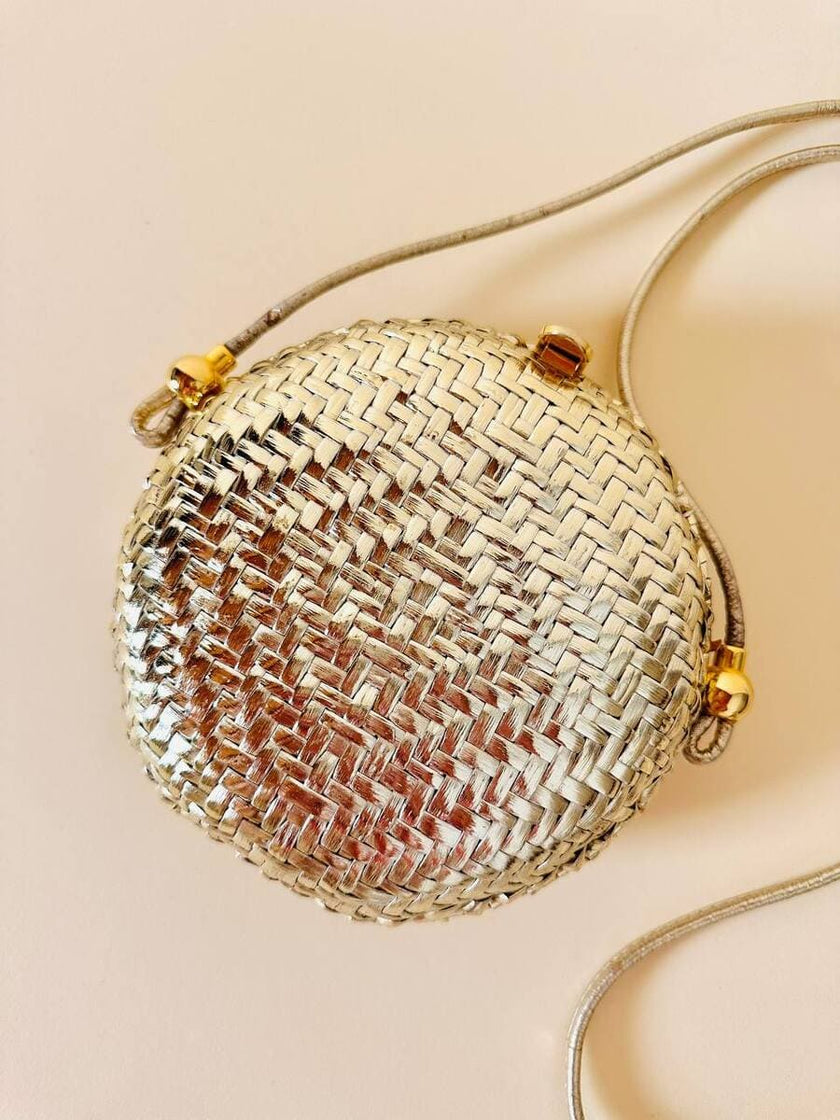 Borsa rotonda in midollino oro con tracolla in pelle laminata oro “Rodo”