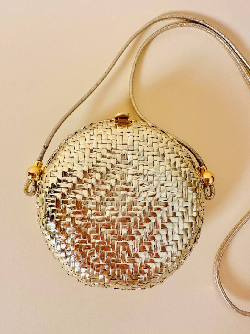 Borsa rotonda in midollino oro con tracolla in pelle laminata oro “Rodo”