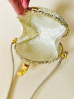 Borsa rotonda in midollino oro con tracolla in pelle laminata oro “Rodo”