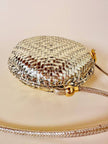 Borsa rotonda in midollino oro con tracolla in pelle laminata oro “Rodo”