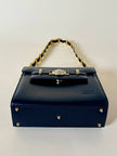 Borsa in pelle blu con hardware oro “Gianni Versace”