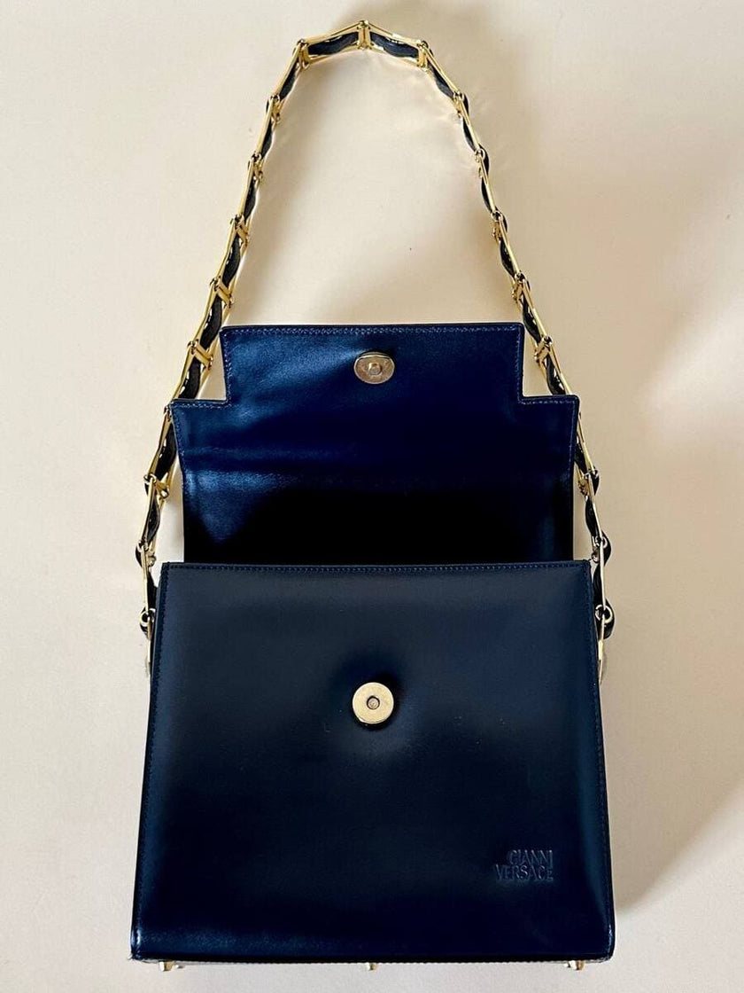 Borsa in pelle blu con hardware oro “Gianni Versace”